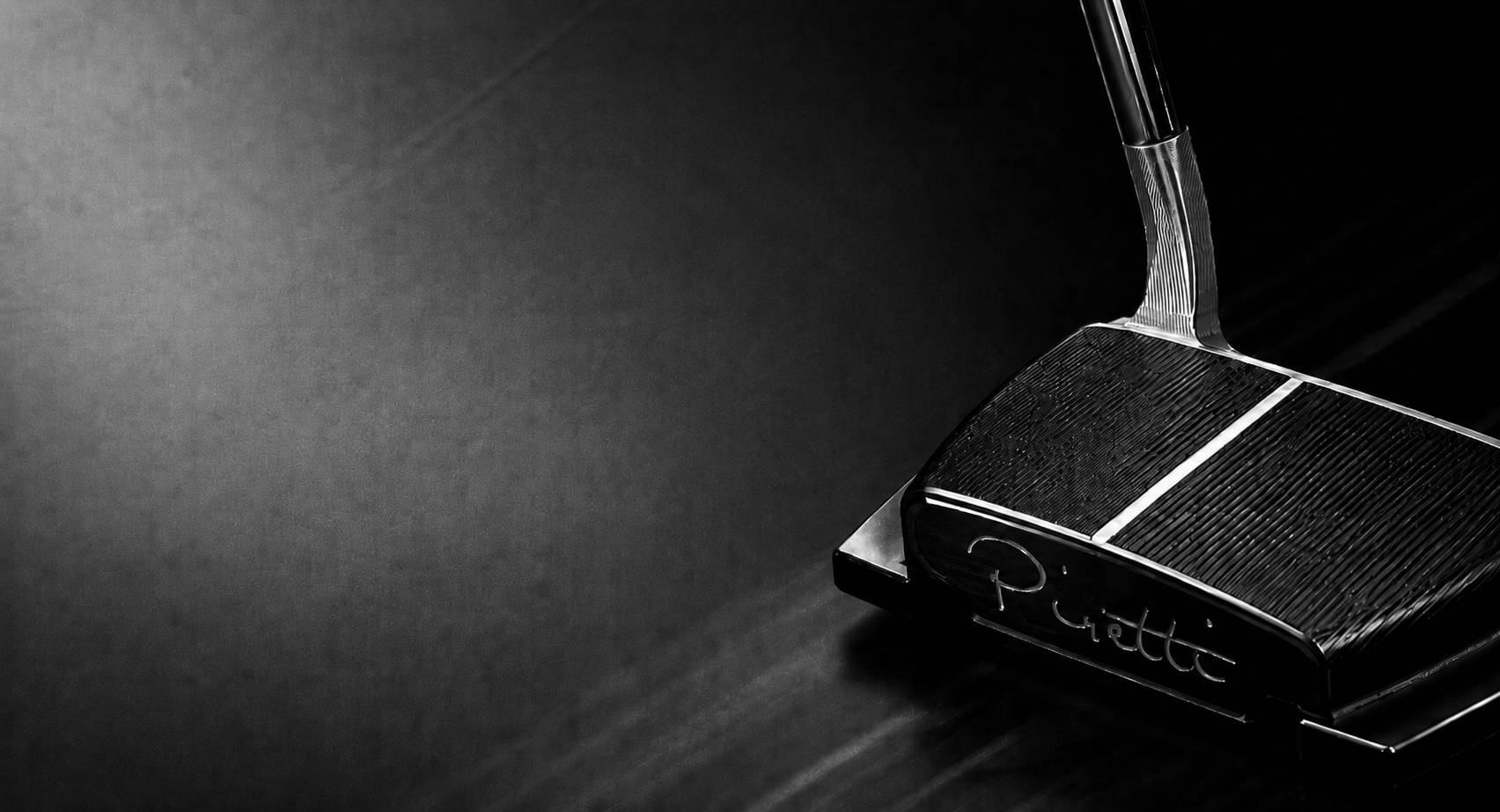 Piretti Golf putter in dramatic black and white lighting